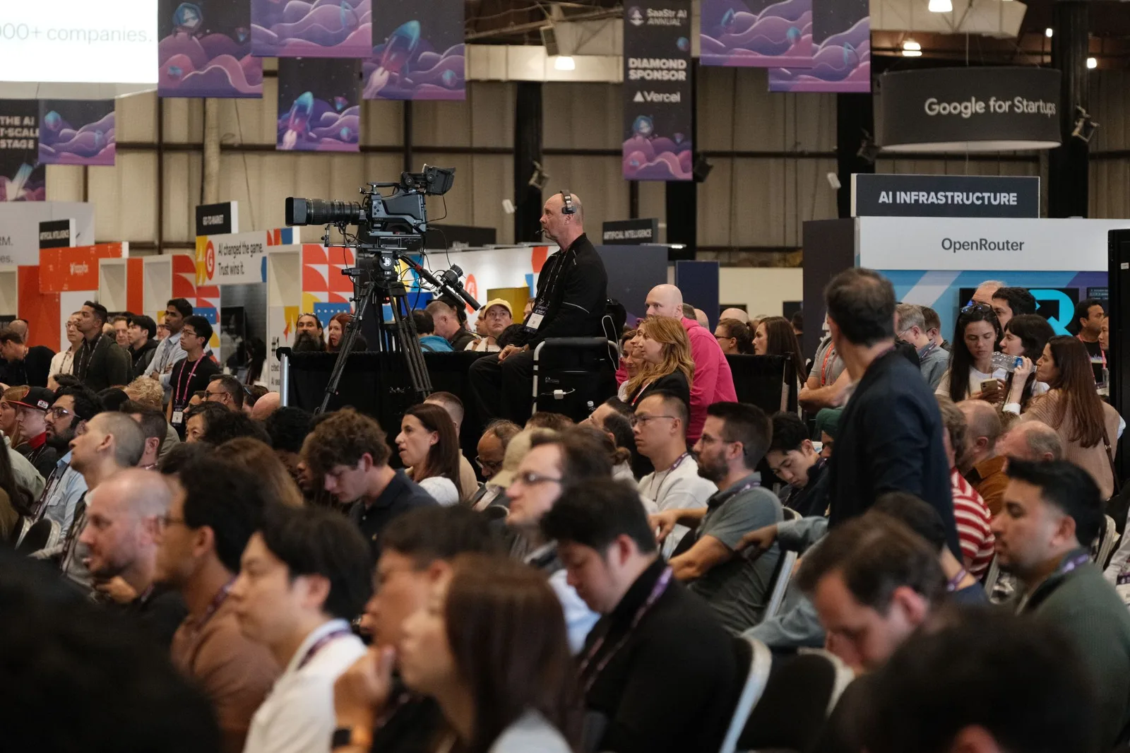 A packed audience watching a keynote on the SaaStr main stage